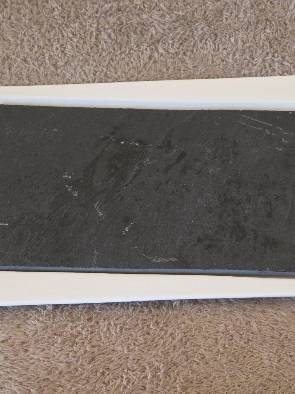 Slate cheese board on porcelain tray